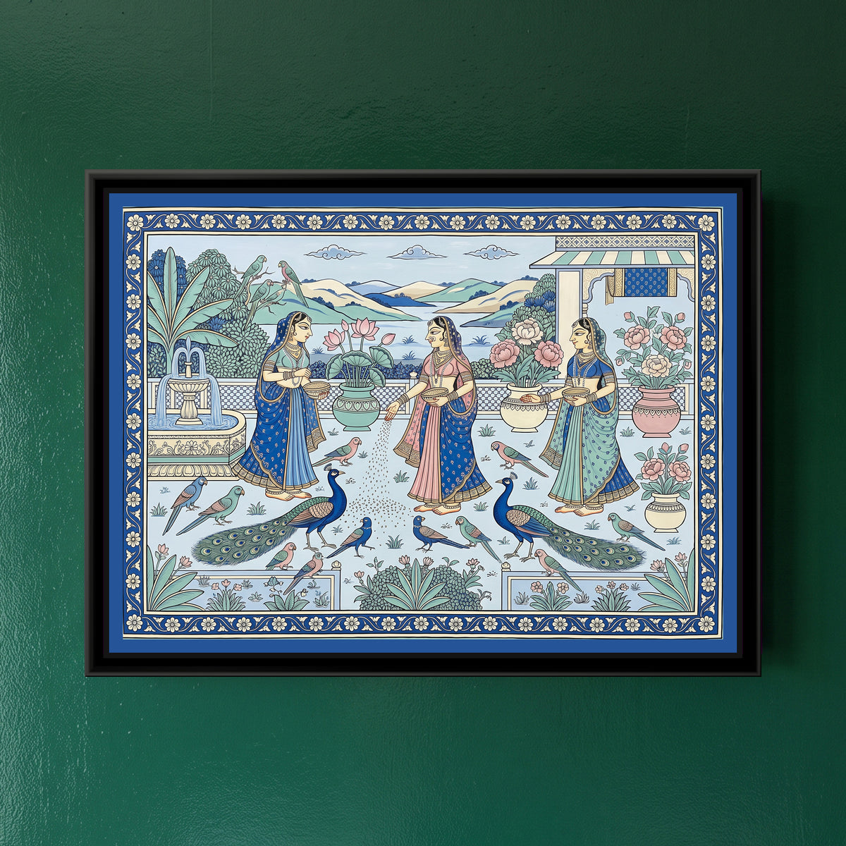 Phad Painting – Feeding the Peacocks on a Palace Terrace - framed canvas print of three ladies feeding peacocks and parrots on a palace terrace by a lake, Phad style, hung on a wall