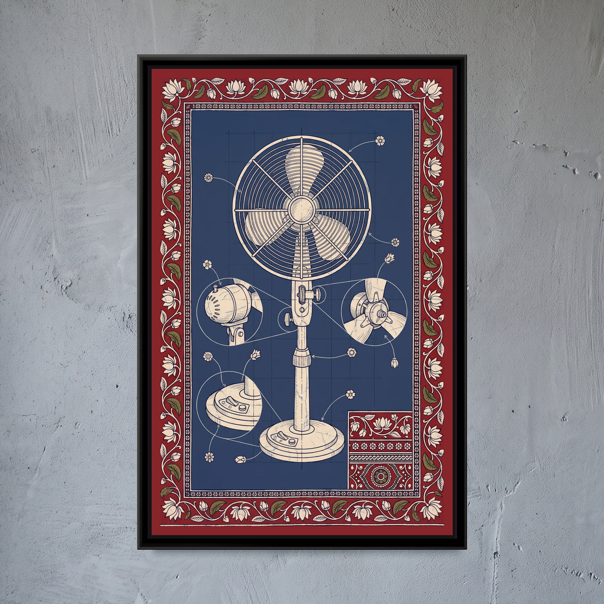 Kalamkari Blueprint – Table Fan - framed canvas print of a cream line drawing of a vintage pedestal fan on an indigo blueprint grid, with detail circles of the motor housing, the blade hub and the switch base, flower-tipped pointer lines, a small patterned swatch in one corner, deep red border of lotuses and leaves, hung on a wall