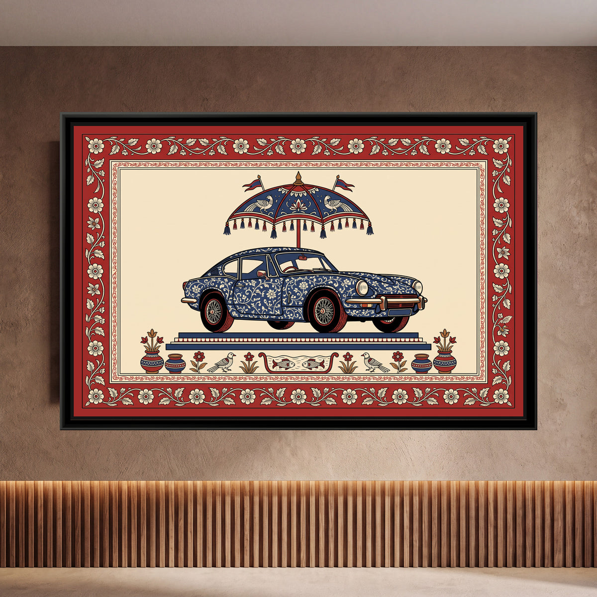Kalamkari Painting – Classic Sports Coupe - framed canvas print of a vintage two-door sports coupe with round headlamps and wire wheels, its body covered in cream floral vines on indigo, parked on a stepped indigo and red platform under a tasselled red and indigo parasol with two pennants and bird motifs, a row of pots, birds, flowers and a little boat of fish along the base, a cream ground, a red border of cream flowers on a trailing vine, hung on a wall