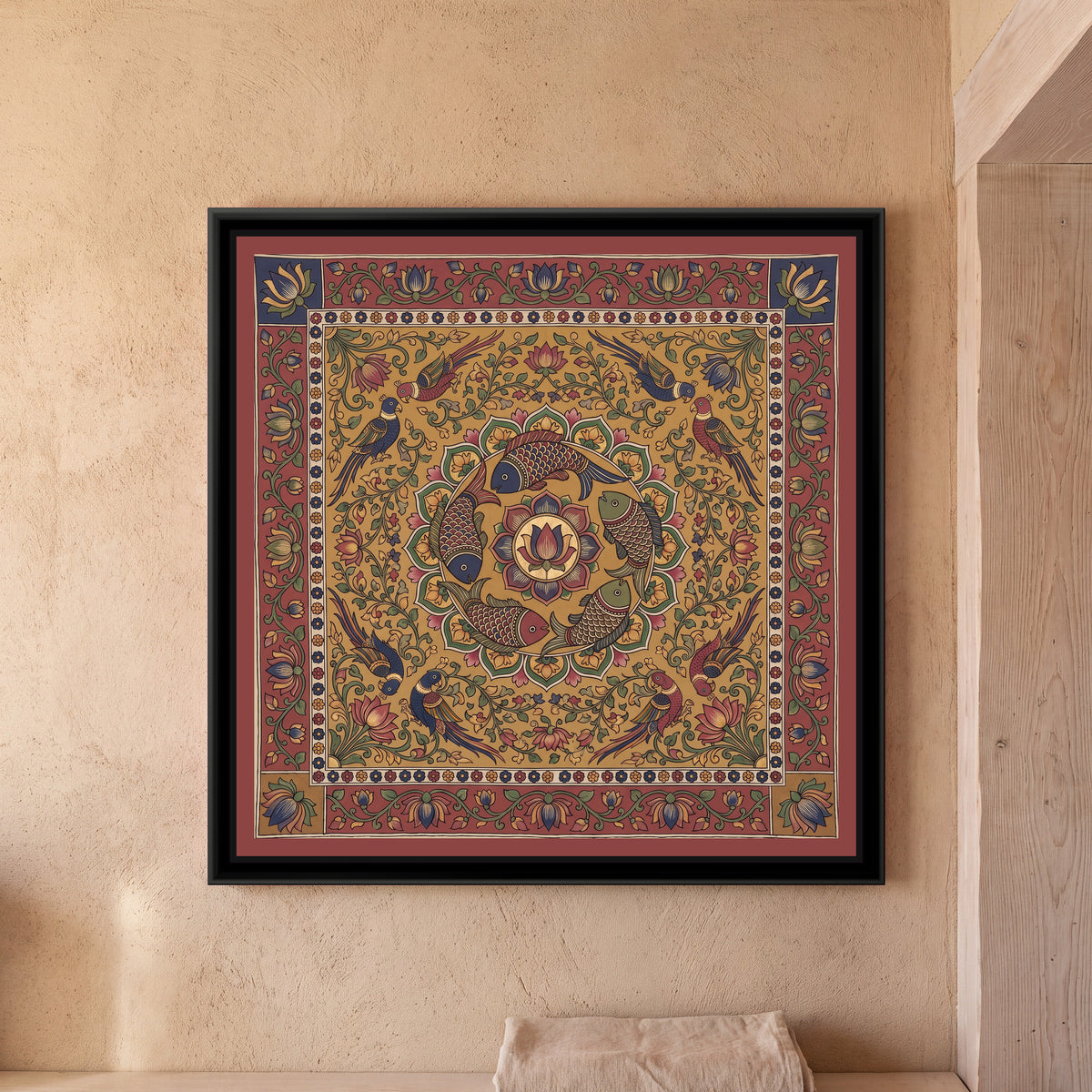 Kalamkari Painting – Fish Mandala - framed canvas print of a ring of fish around a lotus in Kalamkari style, hung on a wall