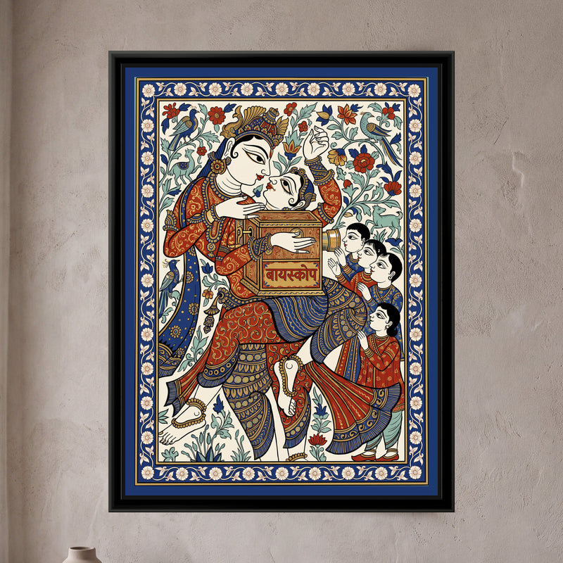 Phad Painting – Bioscope Wala - framed canvas print of a showman in a jewelled headdress leaning over a wooden bioscope box with a brass eyepiece, a line of children waiting their turn, birds and flowers behind, Phad style in red and cobalt, hung on a wall