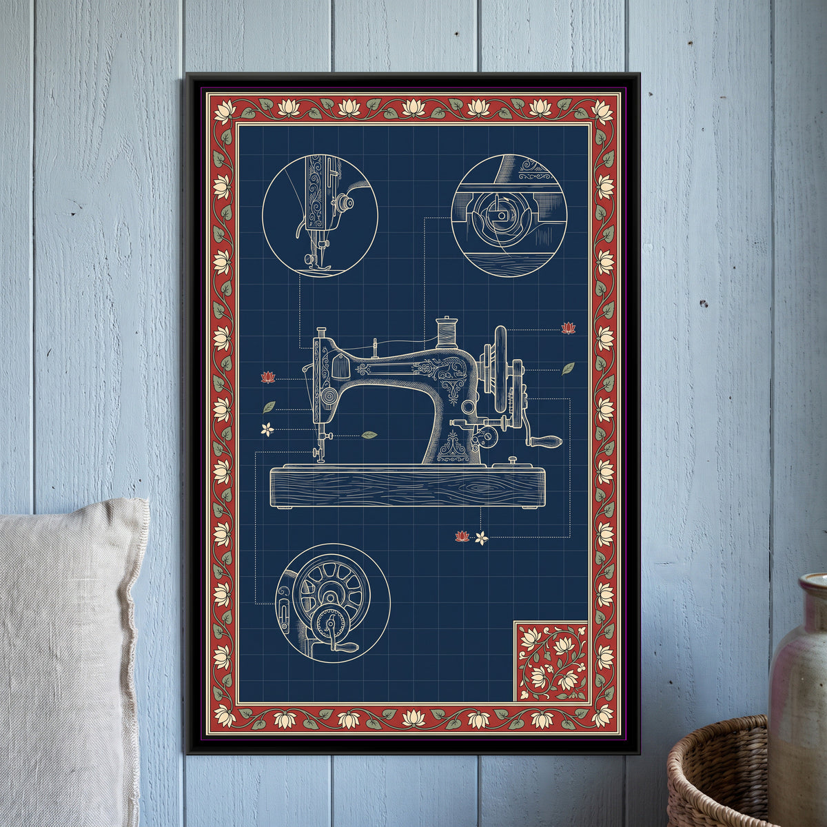 Kalamkari Blueprint – Sewing Machine - framed canvas print of a cream line drawing of a vintage hand-crank sewing machine on a wooden base set on an indigo blueprint grid, three circular close-ups of the needle and presser foot, the bobbin case and the hand wheel, dotted leader lines ending in small lotus and leaf motifs, a red and cream lotus vine border with a floral corner panel, hung on a wall
