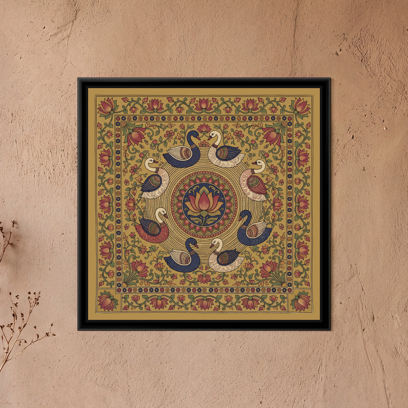 Kalamkari Painting – Circle of Swans - framed canvas print of eight swans in indigo, cream and red with finely patterned wings swimming in a circle on rippling ochre water lines around a central medallion of a red and ochre lotus on indigo inside a ring of red petals, lotus vines and small flowers filling the corners of an ochre ground, a cream band of small red and indigo flowers, an outer border of red lotuses on a trailing vine, hung on a wall