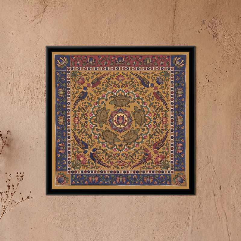 Kalamkari Painting – Turtle Mandala - framed canvas print of five olive green turtles with finely patterned shells swimming in a ring around a central lotus medallion inside a circle of green, pink and mustard petals, eight parrots in pairs among lotus vines, all on a mustard ochre ground, a cream band of tiny flowers, an outer indigo border of lotus vines with a red top panel and ochre lower corners, hung on a wall